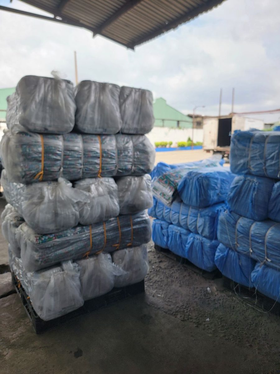 Wrapped Ankara bales stacked on pallets